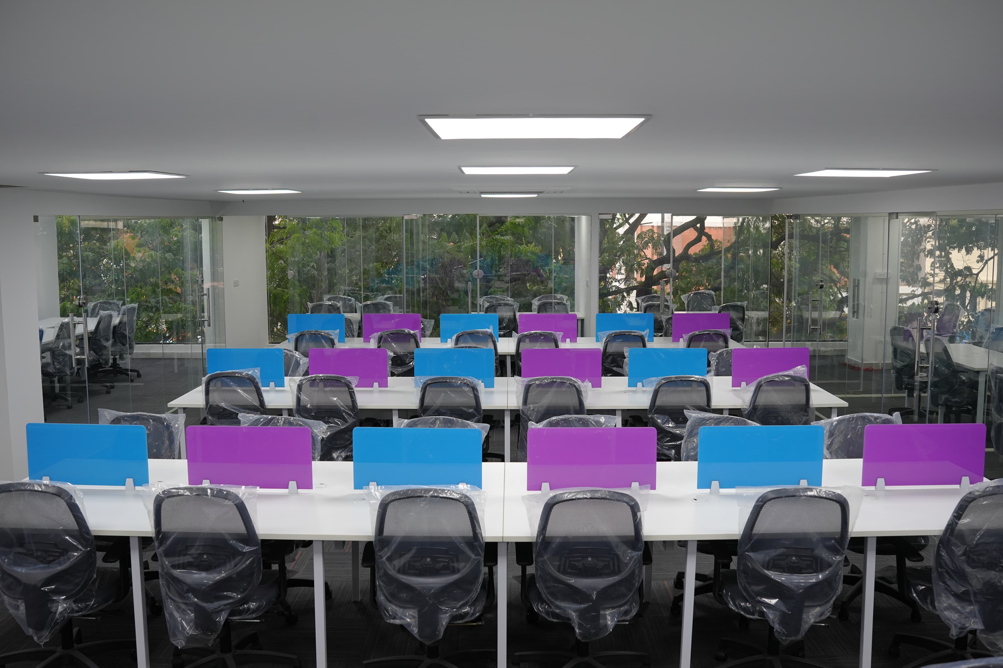Shared workspace with rows of coworking desks